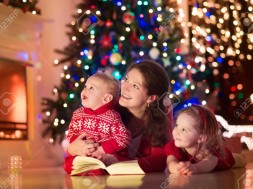 Mother and children at home on Christmas eve