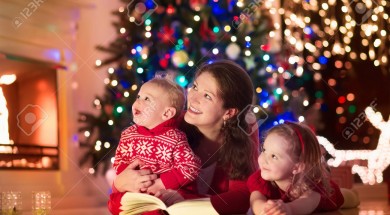 Mother and children at home on Christmas eve