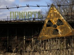 A radioactive sign hangs on barbed wire outside a café in Pripyat.
