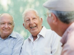 Group of happy elderly men laughing and talking